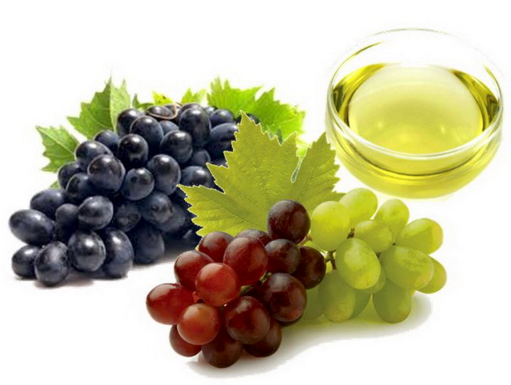 A Bottle Of Organic Grape Seed Oil With Fresh Green Grapes